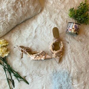 Light pink ruffle and glitter bow heels with lace up strings.